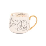 Magic Tour Club Disney Dumbo mok met gouden rand en handvat, versierd met een zwarte lijntekening van Dumbo.